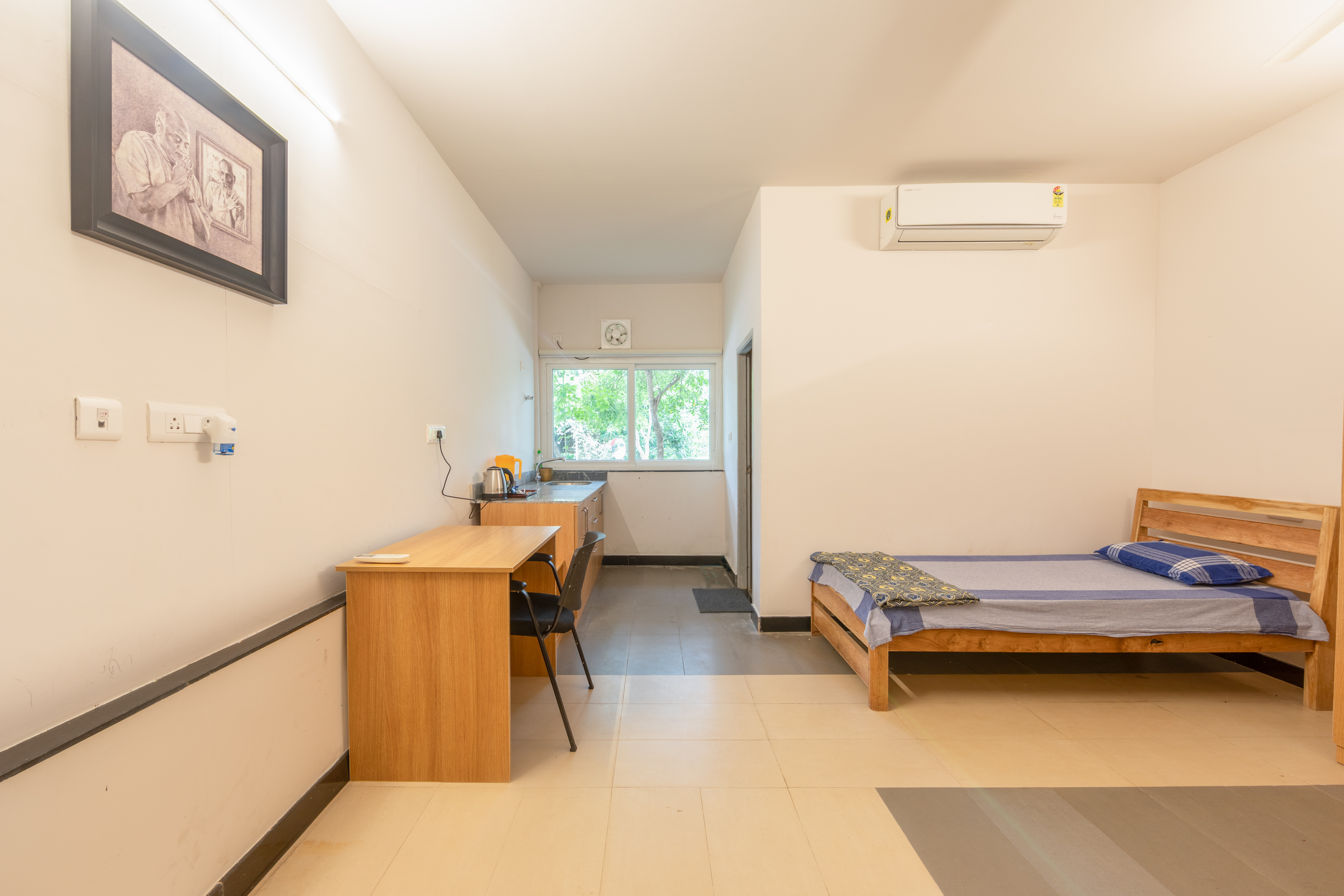 Two single beds either side of a full-height wardrobe in a Freshwater guest room.